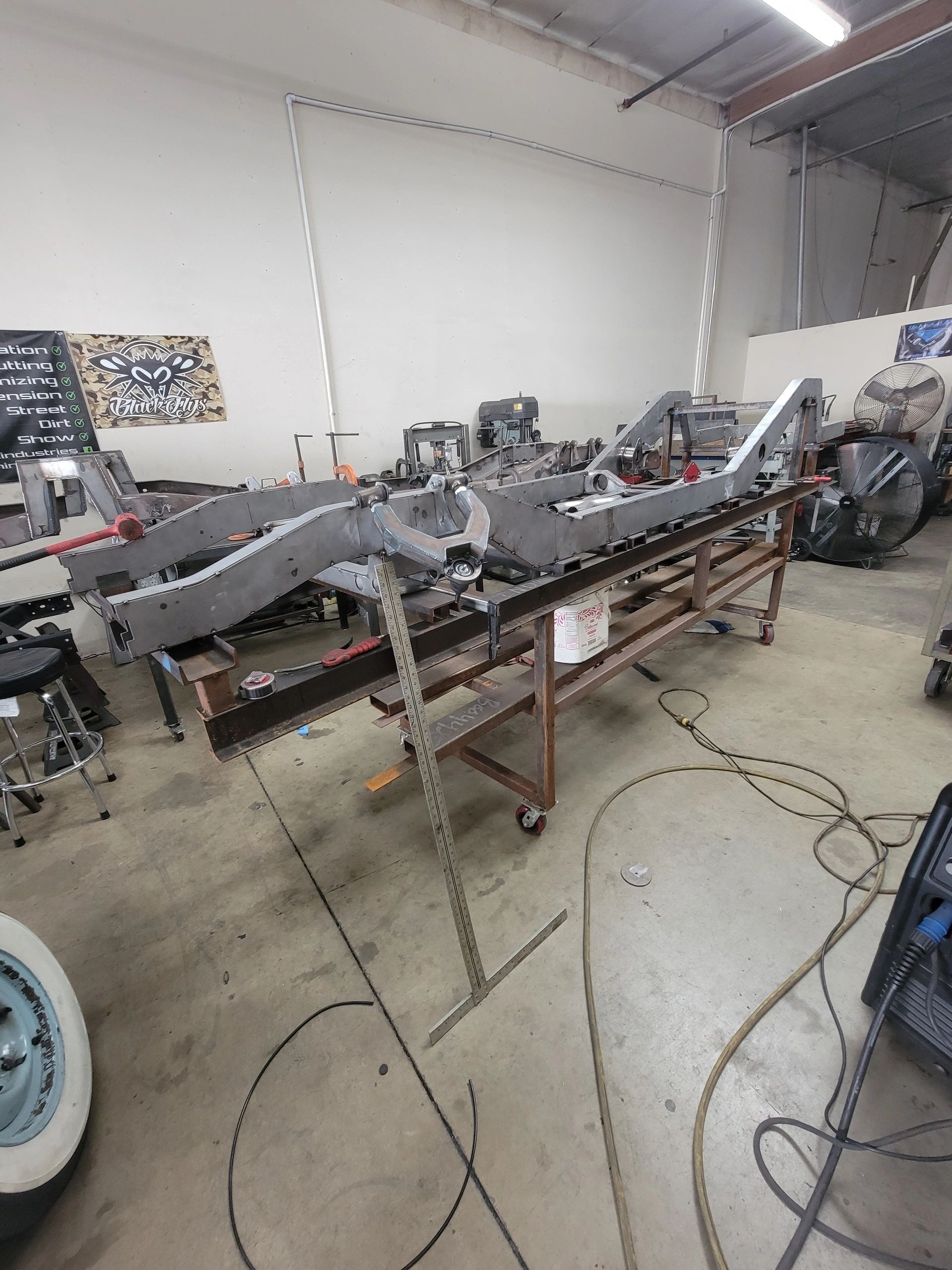 Complete custom chassis jigged on proprietary frame table Ikon Industries